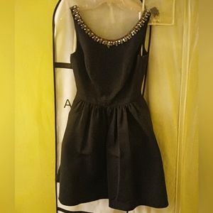 David’s Bridal black beaded neckline with cut out back size 10